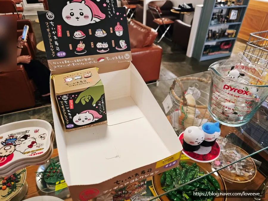 Display of Monchhichi stickers and goods