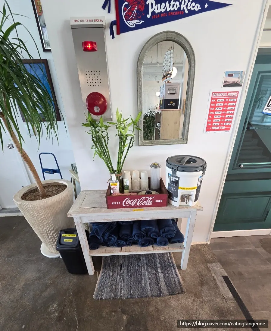 Self-serve bar with water, tissues, and hand cream