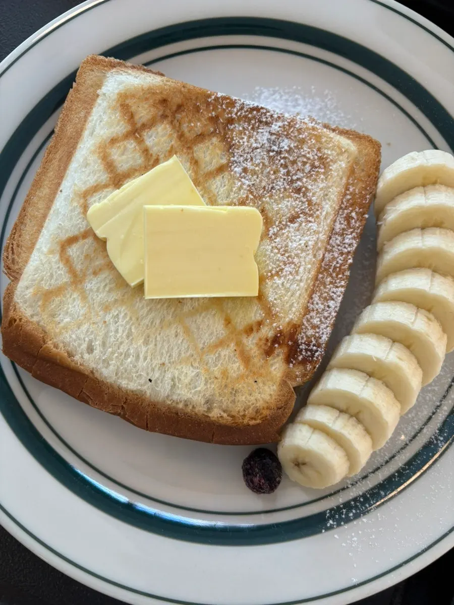 Kaya jam toast topped with unsalted butter, served with fruit