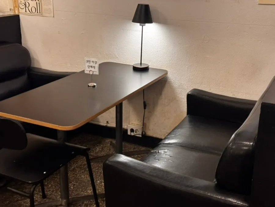 Café seating arranged with black-toned furniture