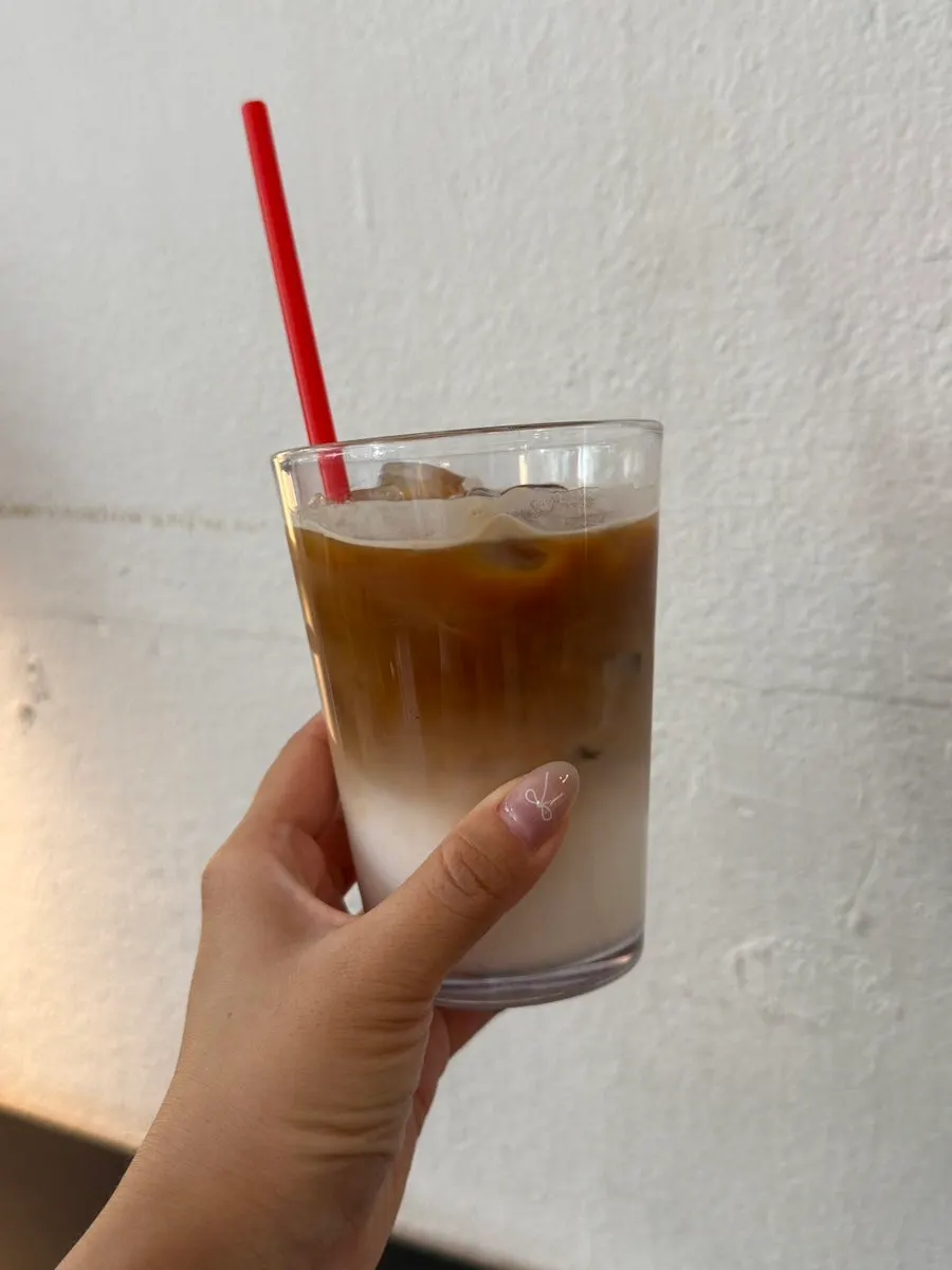 Decaf vanilla latte marked with a red straw