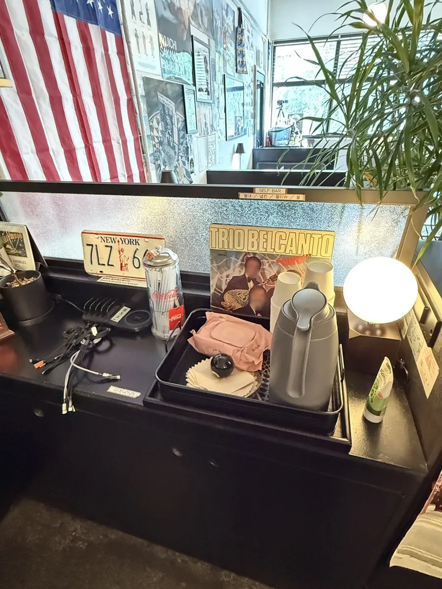 Phone charger, wet wipes, and hand cream by the restroom