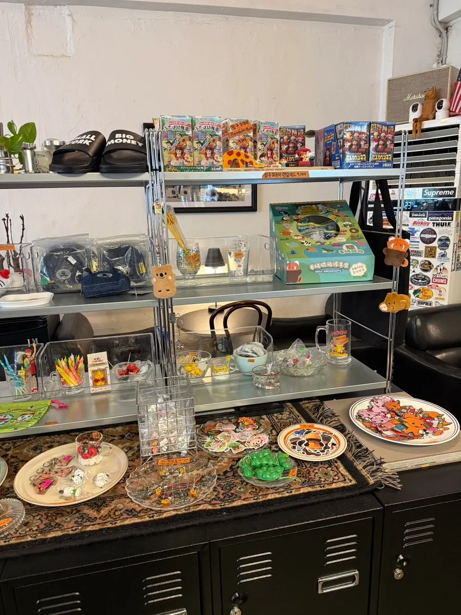 Display shelf of small items in a corner of the café