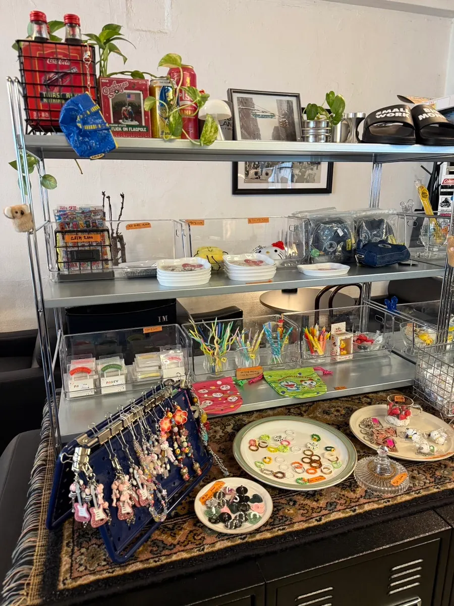 Birthday candles, stickers, keyrings, and other café items