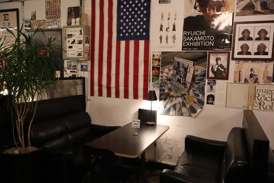 Vintage wall covered with posters and license plates