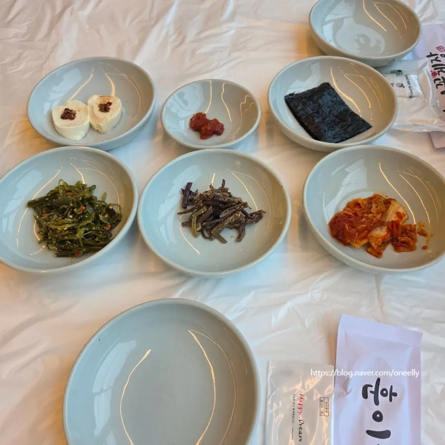 Plastic gloves, utensil set, and wet wipes set out on the table