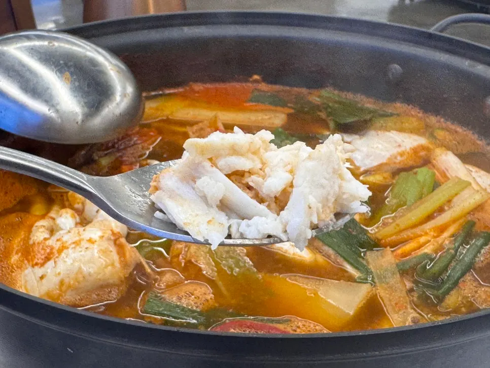 Crab body meat dipped in the broth