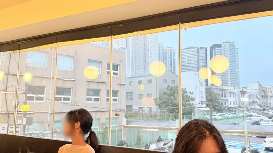 2nd-floor table by the floor-to-ceiling window