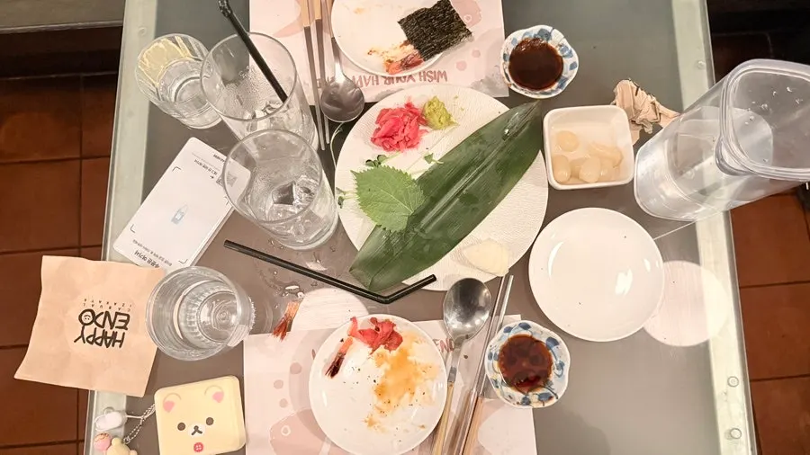 Empty sashimi plate and glasses after the meal