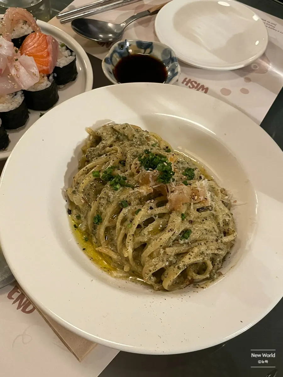 Abalone pieces on top of the pasta