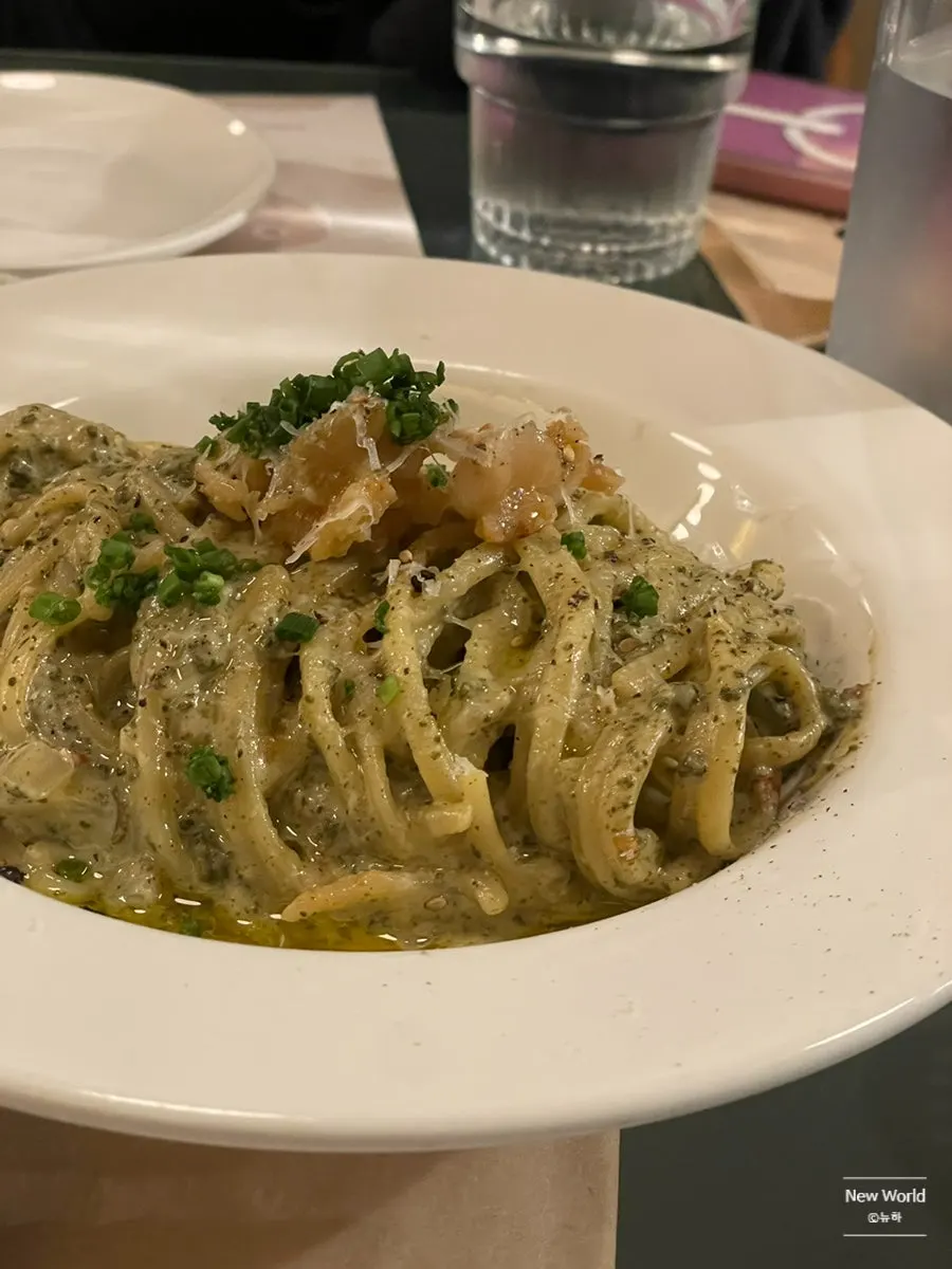 Lifting up noodles from the abalone innards pasta
