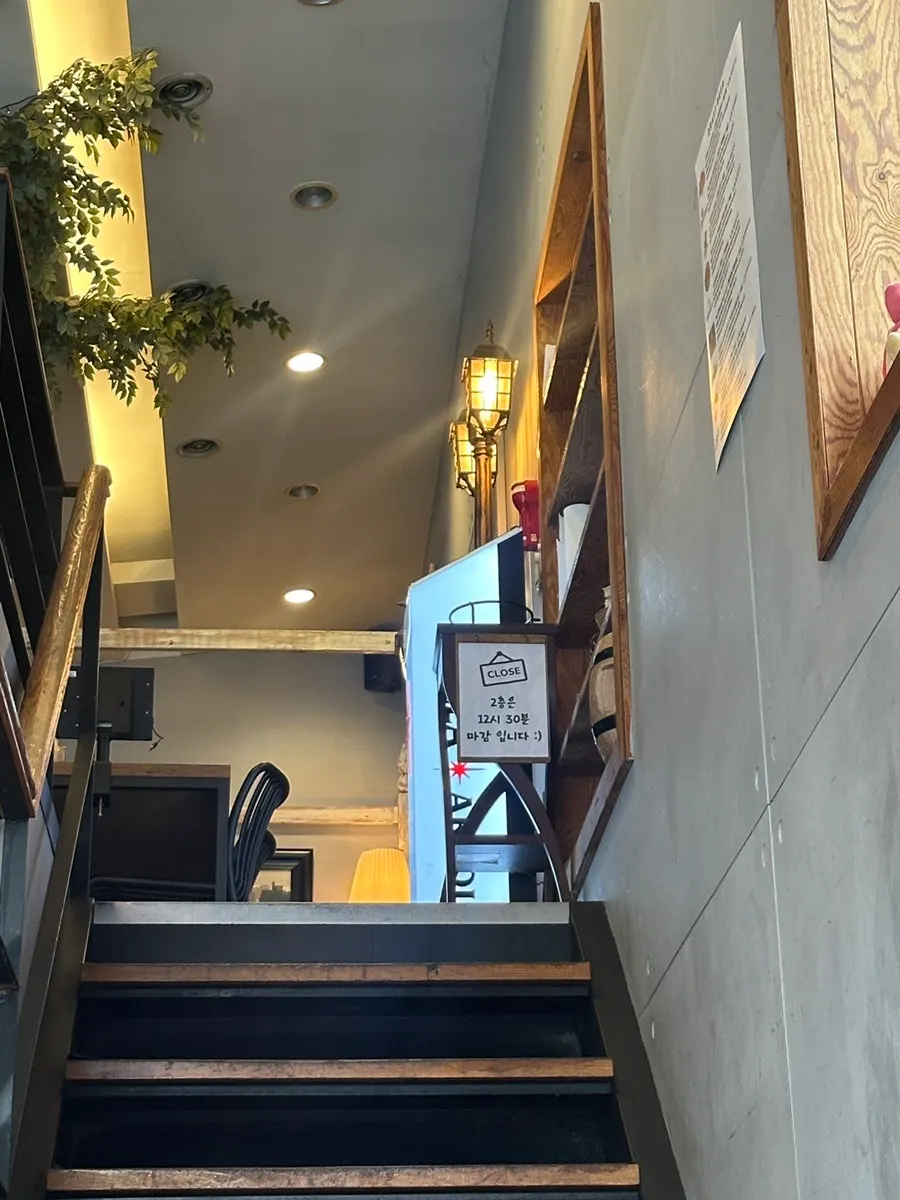 First-floor seating at Hope So with a view toward the stairs