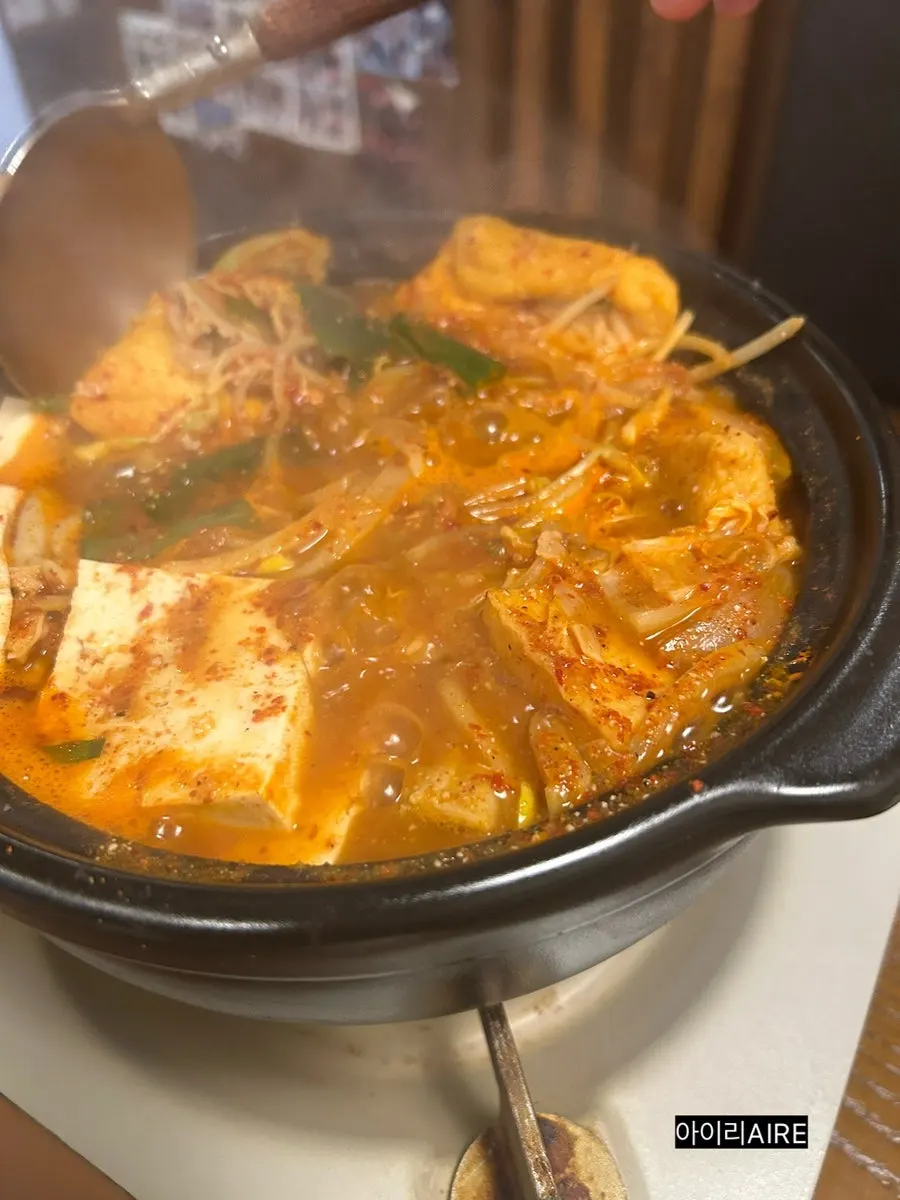 Chewy Korean beef gopchang lifted from the pot