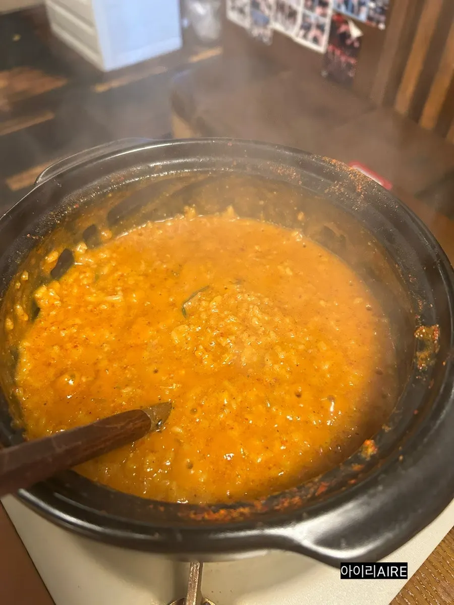 Cheese risotto being made from the leftover broth