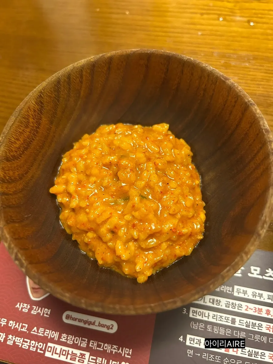 Finished cheese risotto prepared by staff