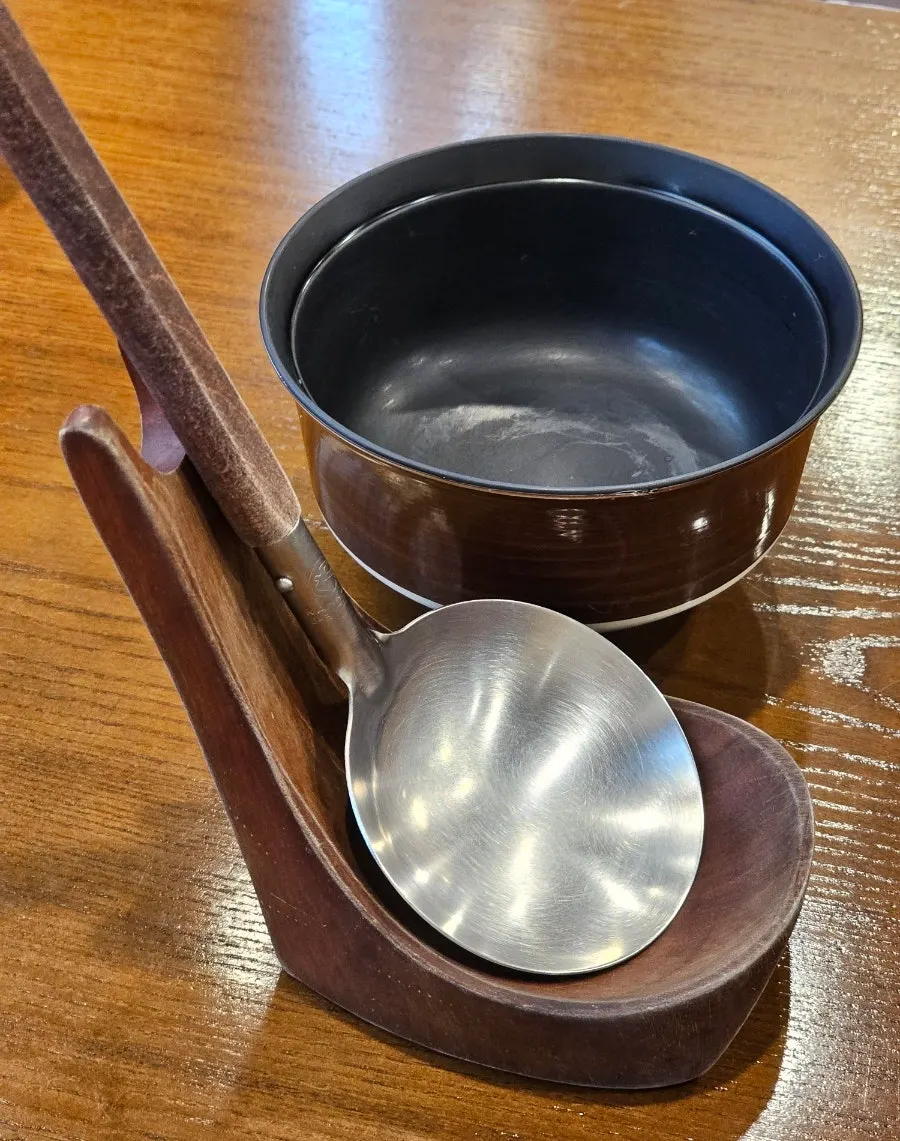 Ladle set on the table for flipping the stew pot