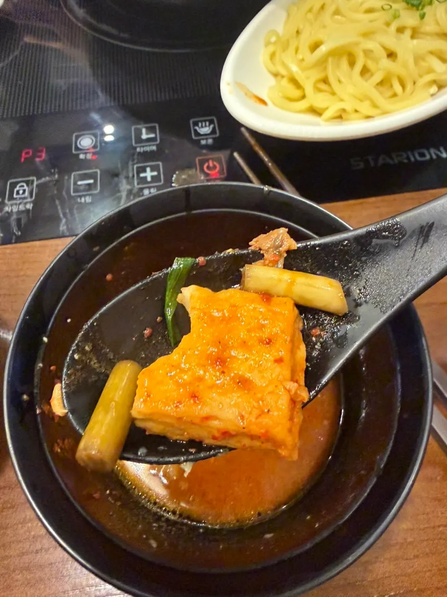 Spicy hotpot broth starting to boil