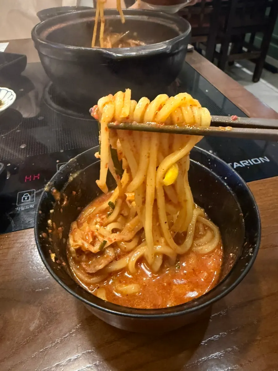 Nearly emptied pot of daechang hotpot