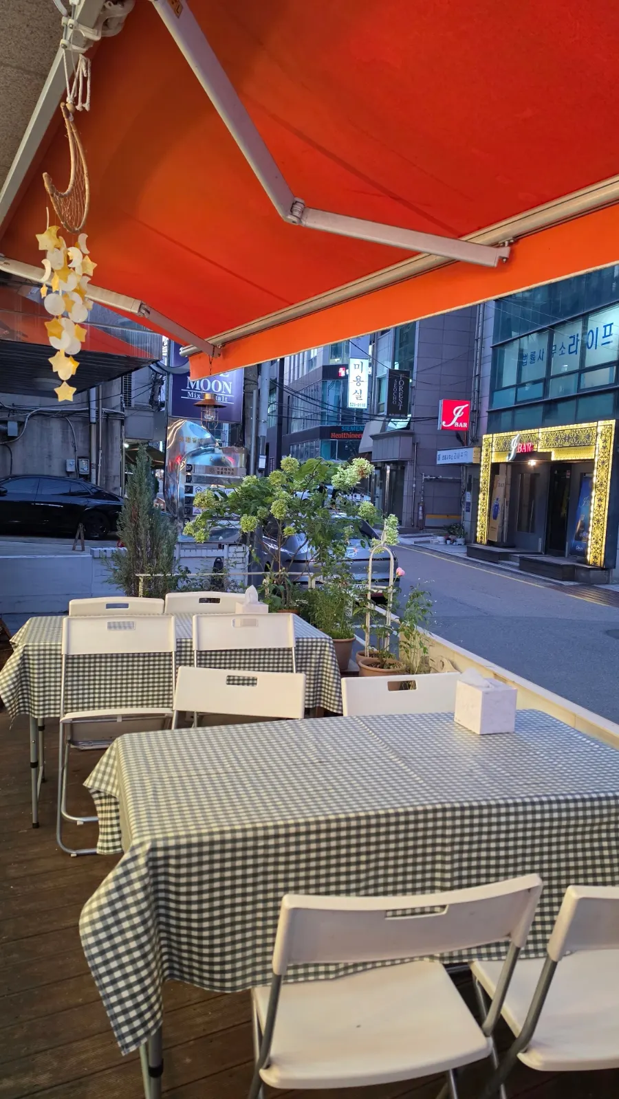 Entrance of Halls Gimbap Main Branch with outdoor tables