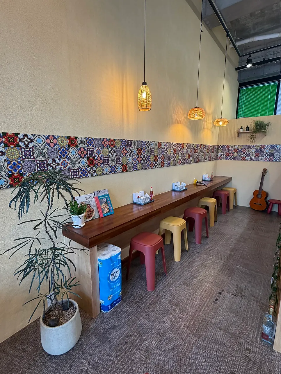 Interior view of Holstaco Yulha under warm lighting