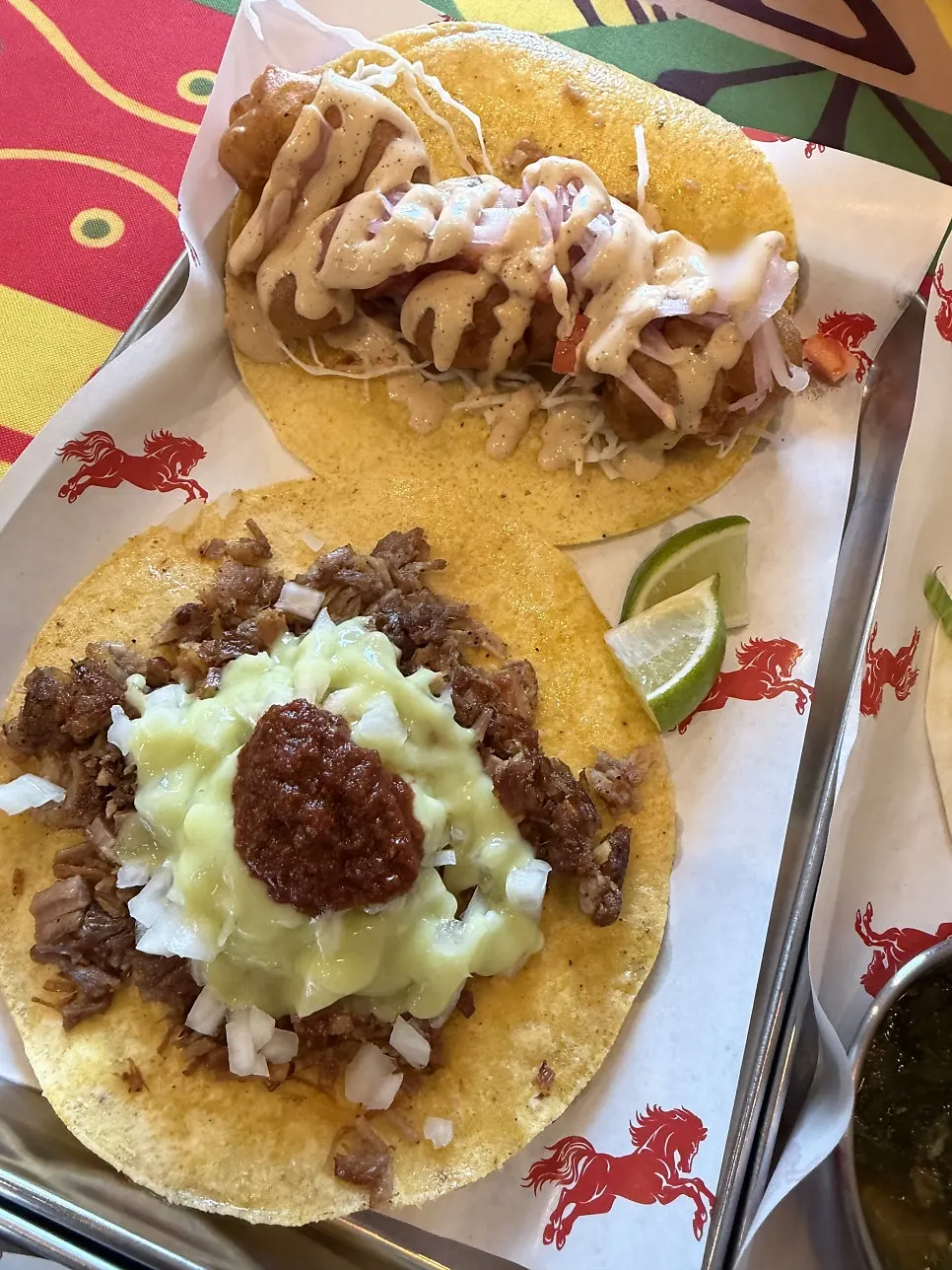 Birria taco being dipped in sauce