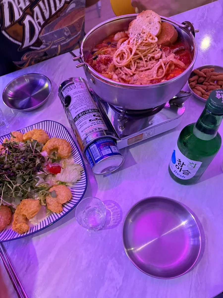Table set with tomato haejang pastang and mango cream shrimp