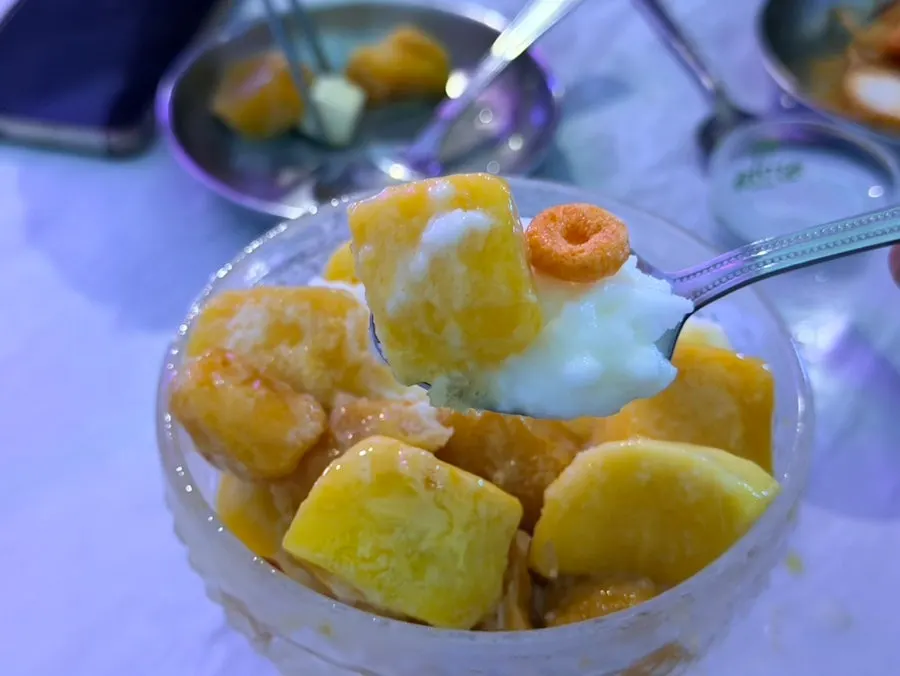 Mango bingsu with colorful cereal topping