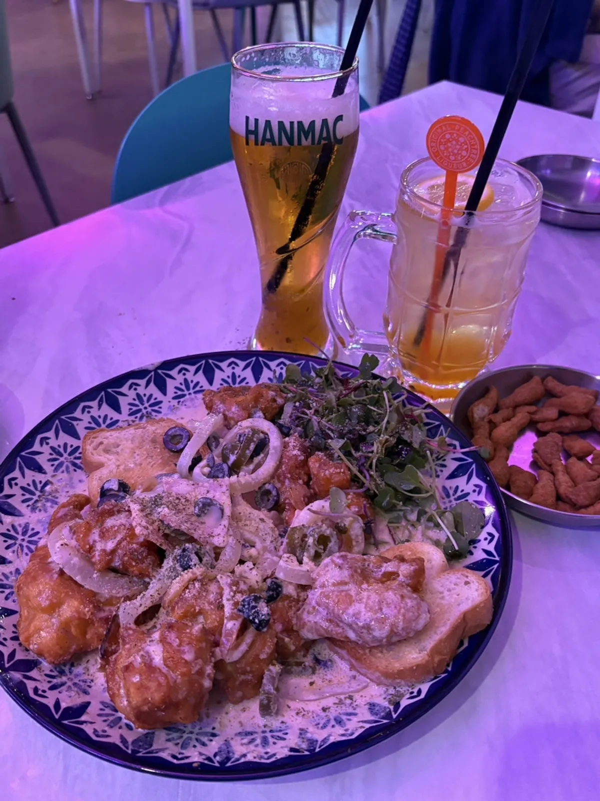 Table set with Ho Samchon's carbo chicken and beer