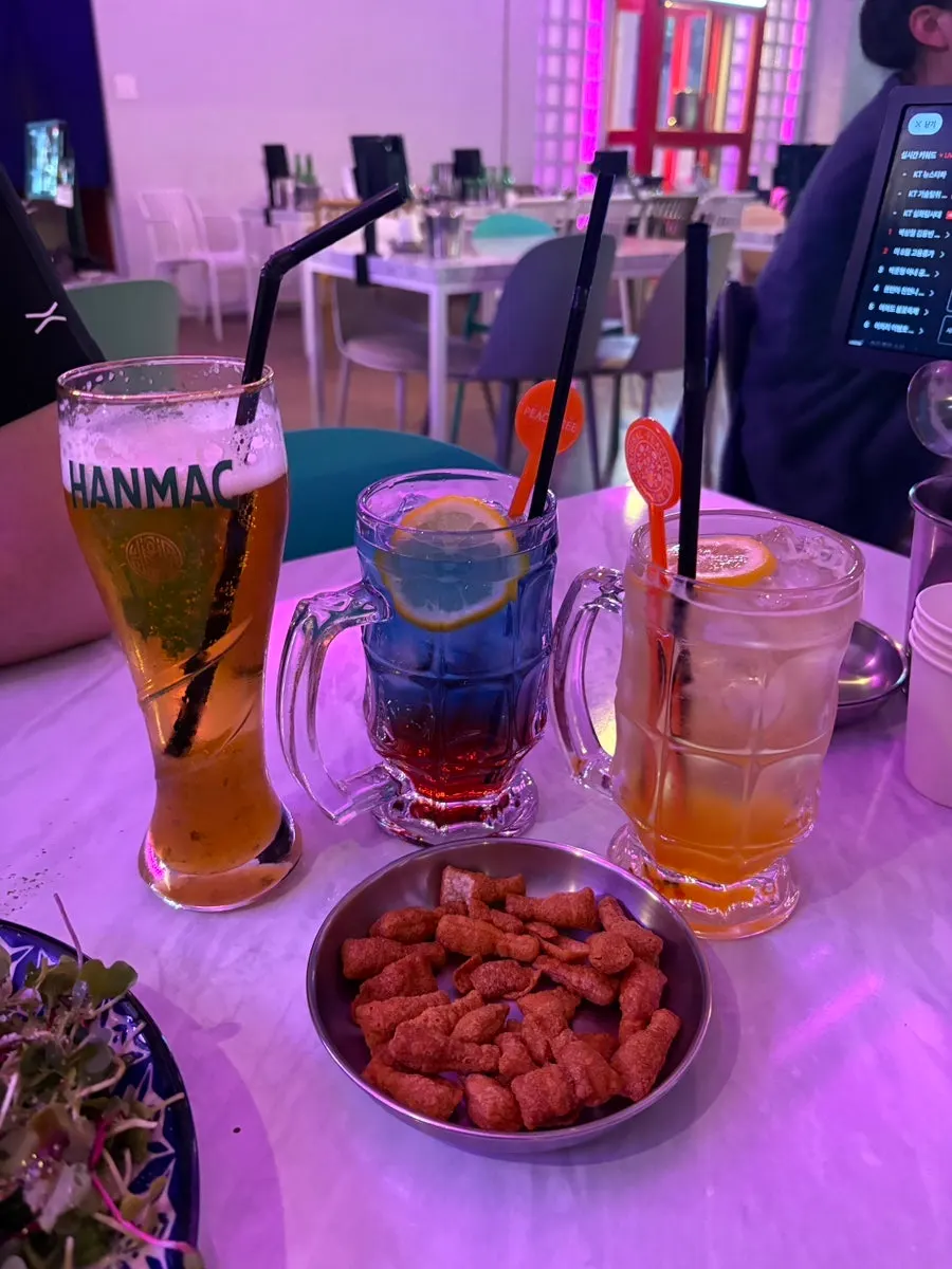 Citrus beer and orange highball glasses side by side