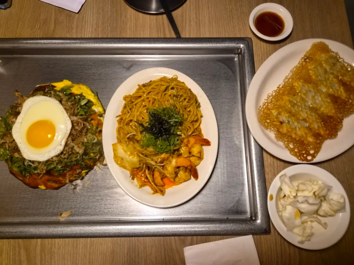 Hiroshima okonomiyaki placed on the tableside hot plate