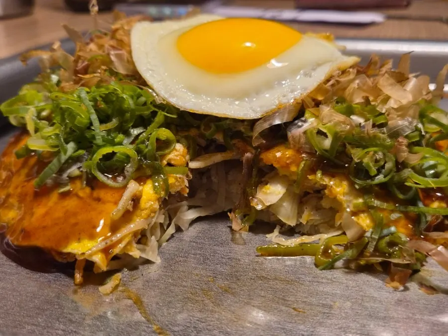 Hiroshima okonomiyaki cut into bite-sized pieces