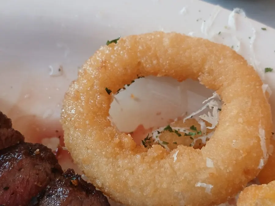 Steak dipped in sauce