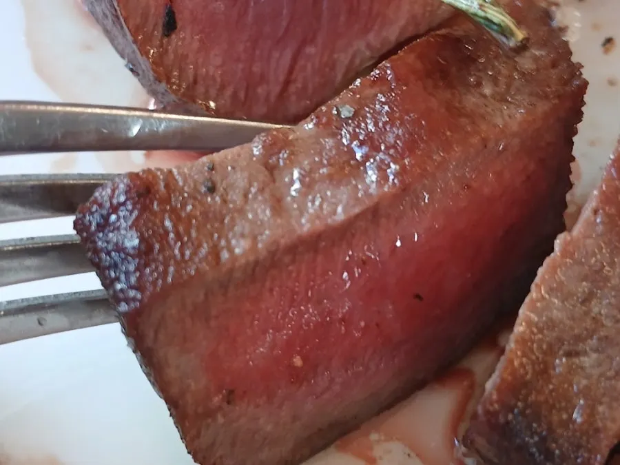 Table with steak and bread