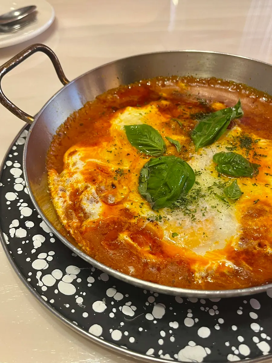 Egg in hell with three soft-boiled eggs at Hôtel de Couture