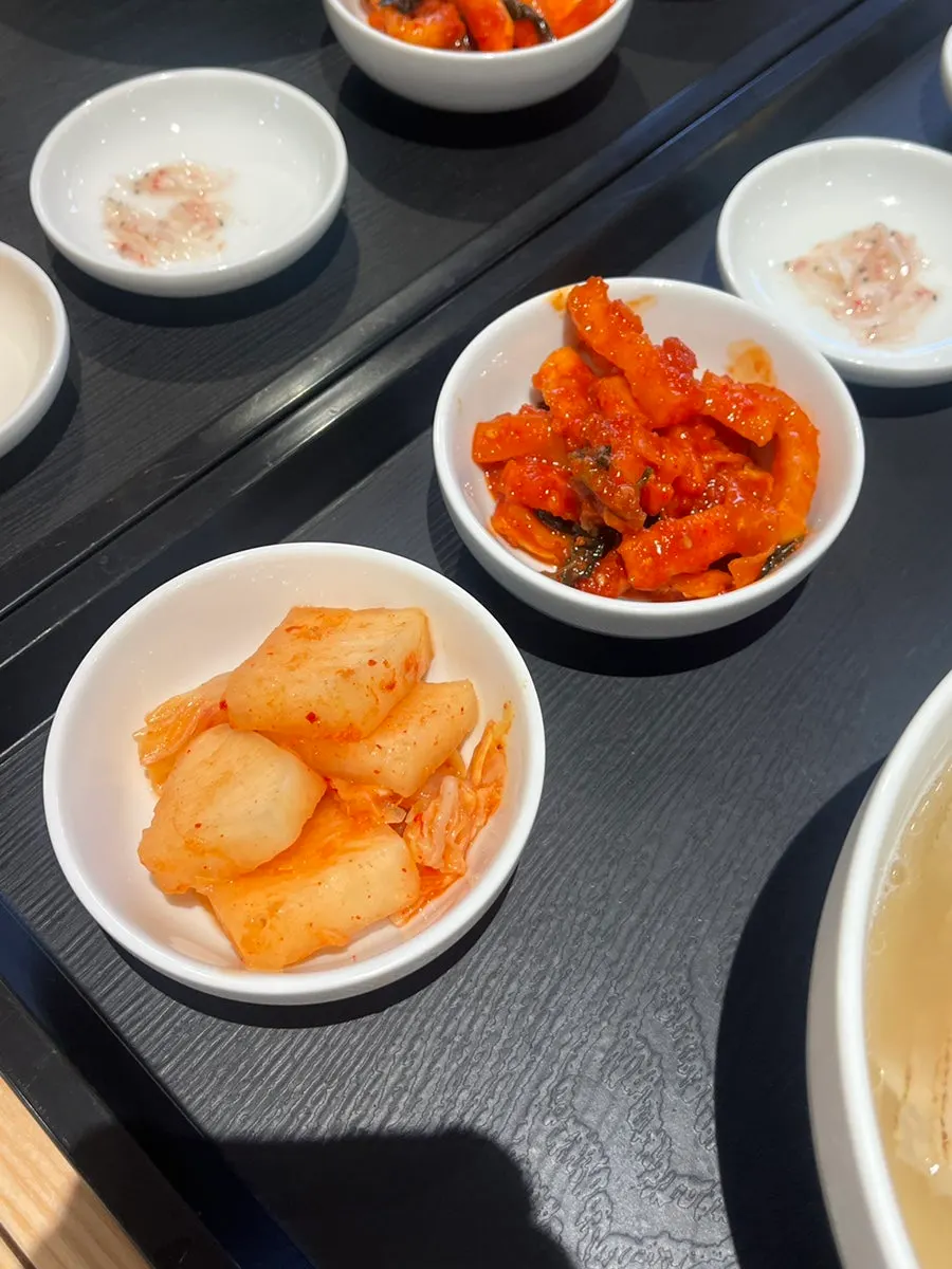 A spoonful of gomtang with gochujji on top