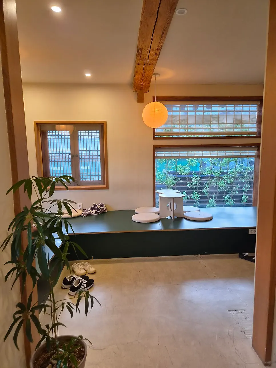Seating by the large window with soft lighting