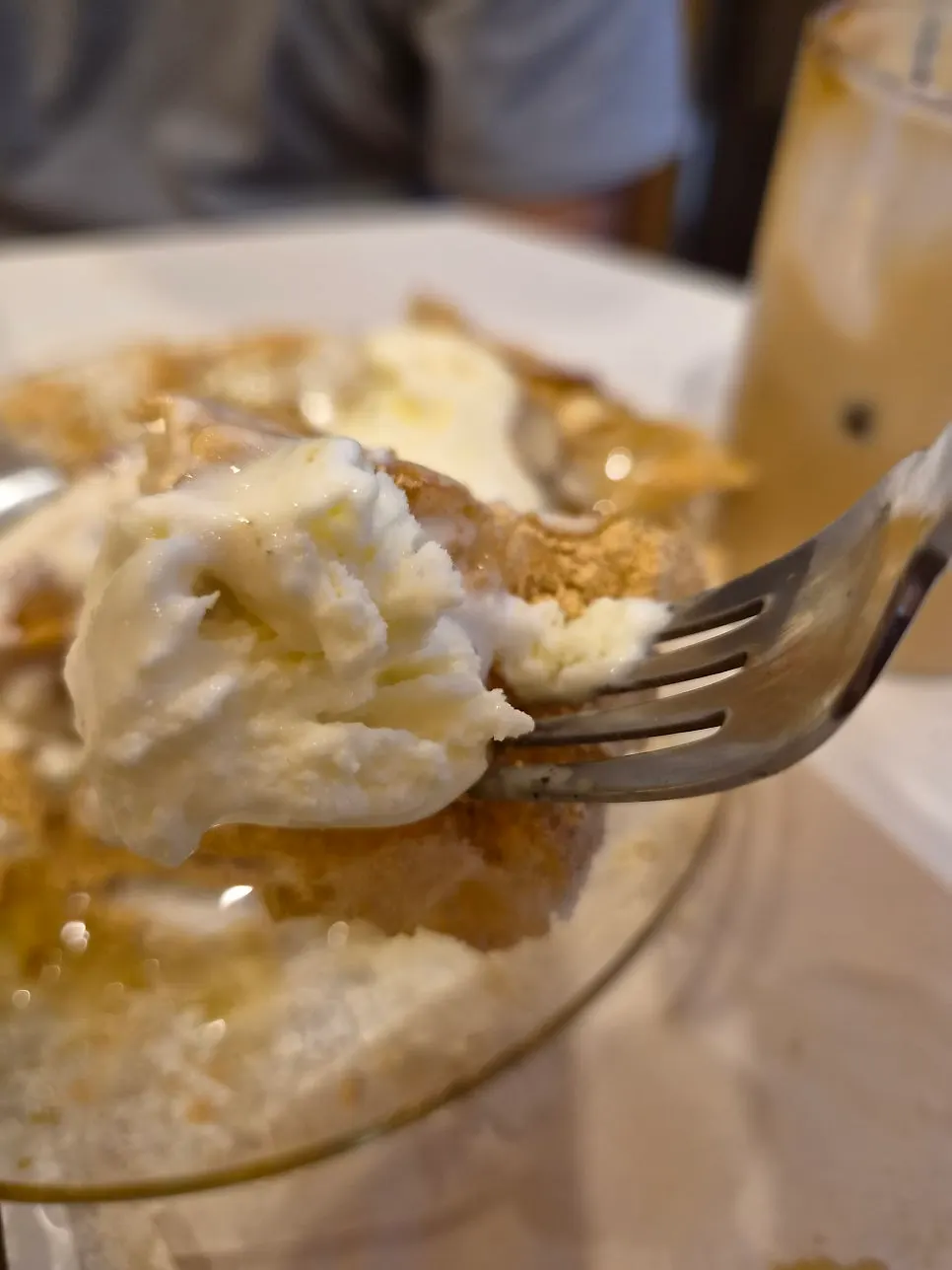 A sliced piece of injeolmi waffle ready to eat