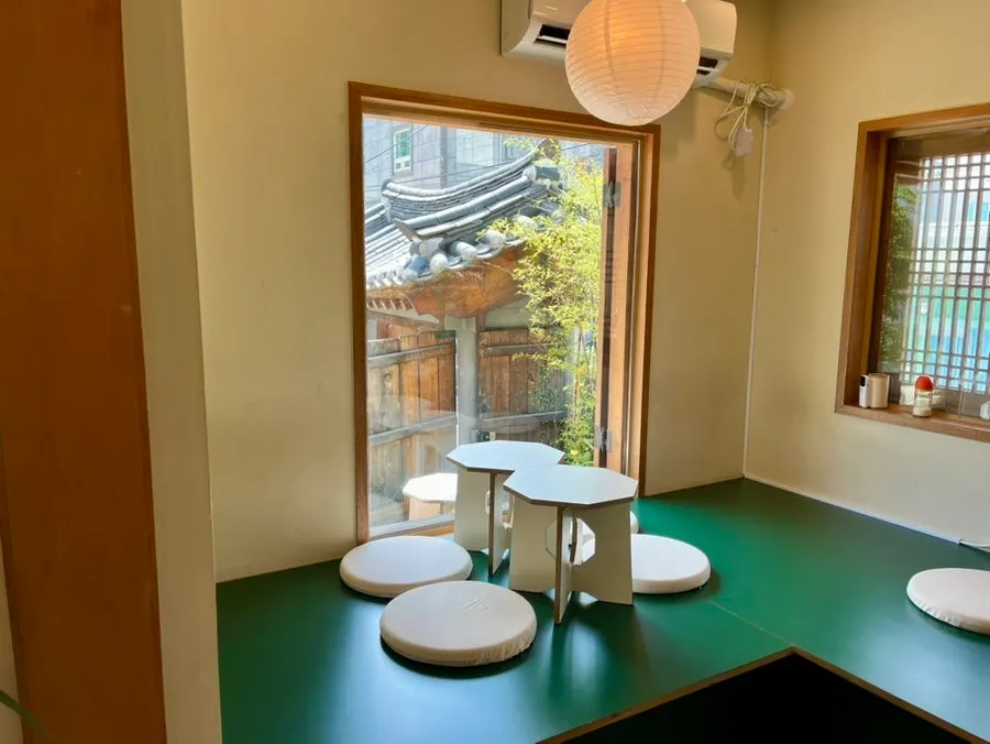 Self-serve bar with blankets, cushions, and water