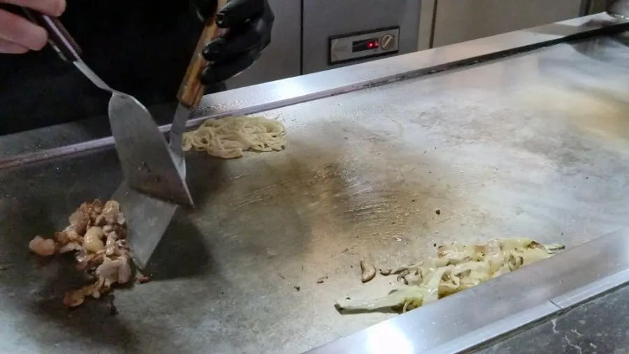 Hiroshima okonomiyaki grilling on the teppan
