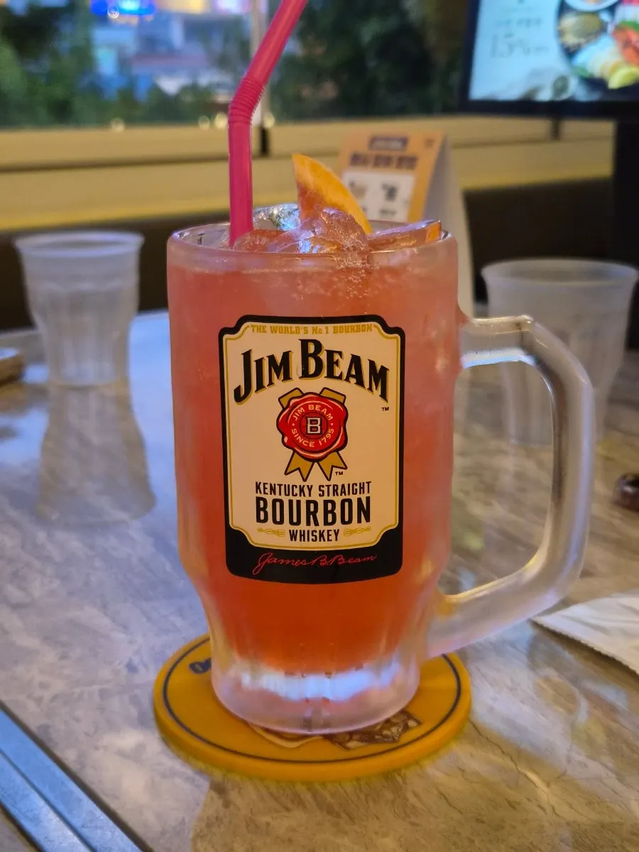 A reddish Jim Beam grapefruit highball