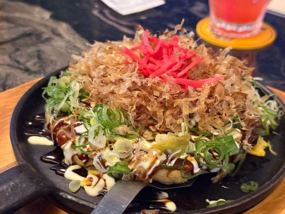 Hiroshima-style okonomiyaki topped with bonito flakes