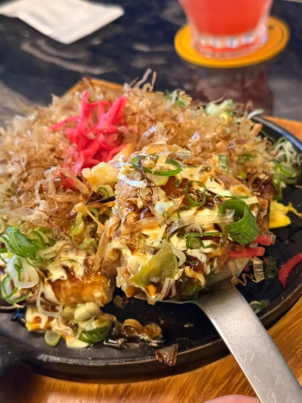 Cross-section of okonomiyaki showing soba noodles and cabbage