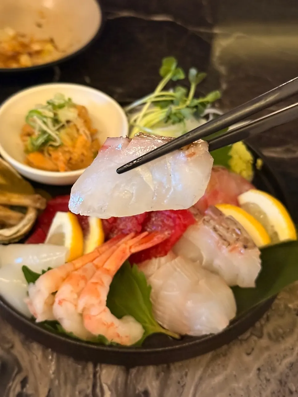 Thickly sliced white fish sashimi