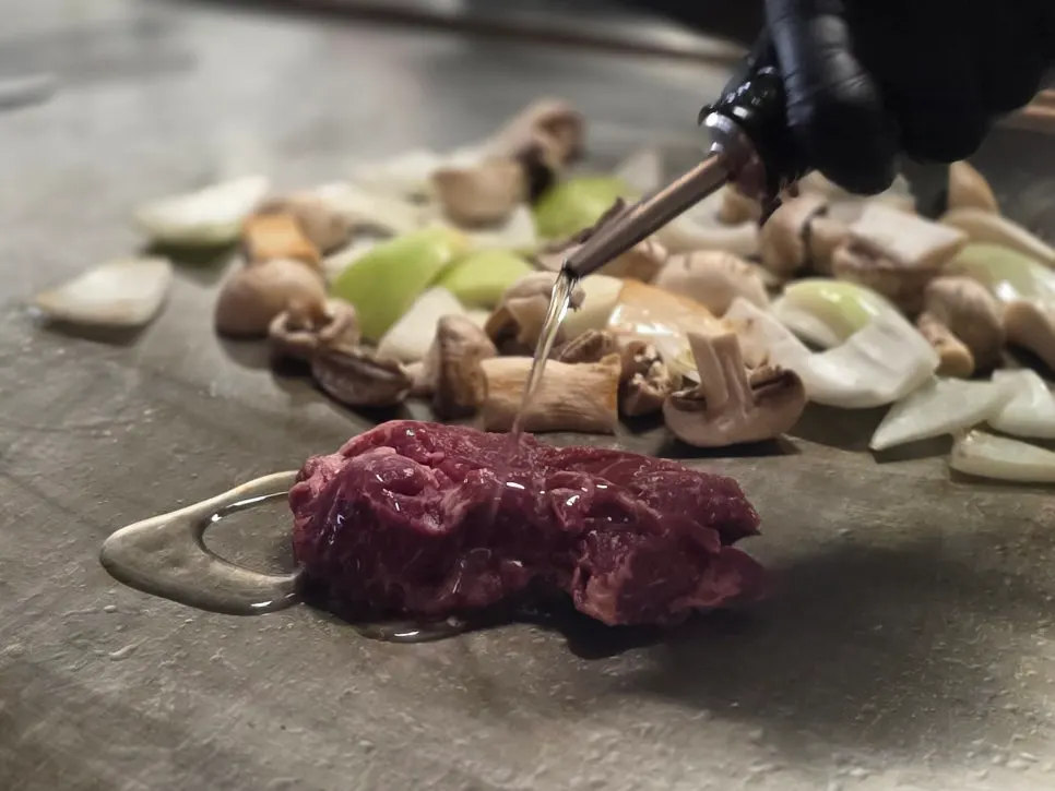 Beef, mushrooms, and onions on the teppan grill