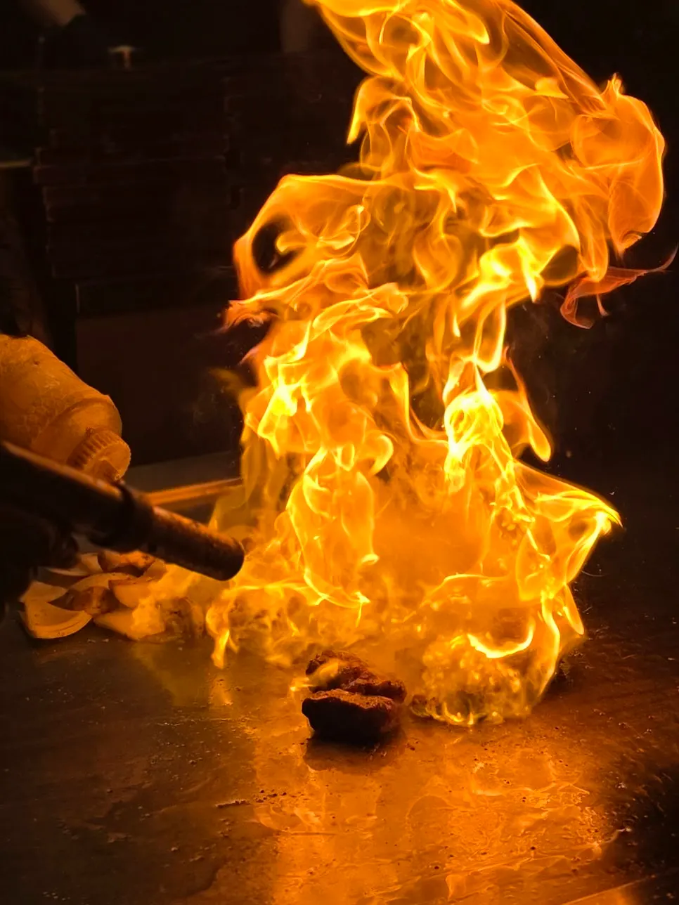 Flames rising during the teppan fire show