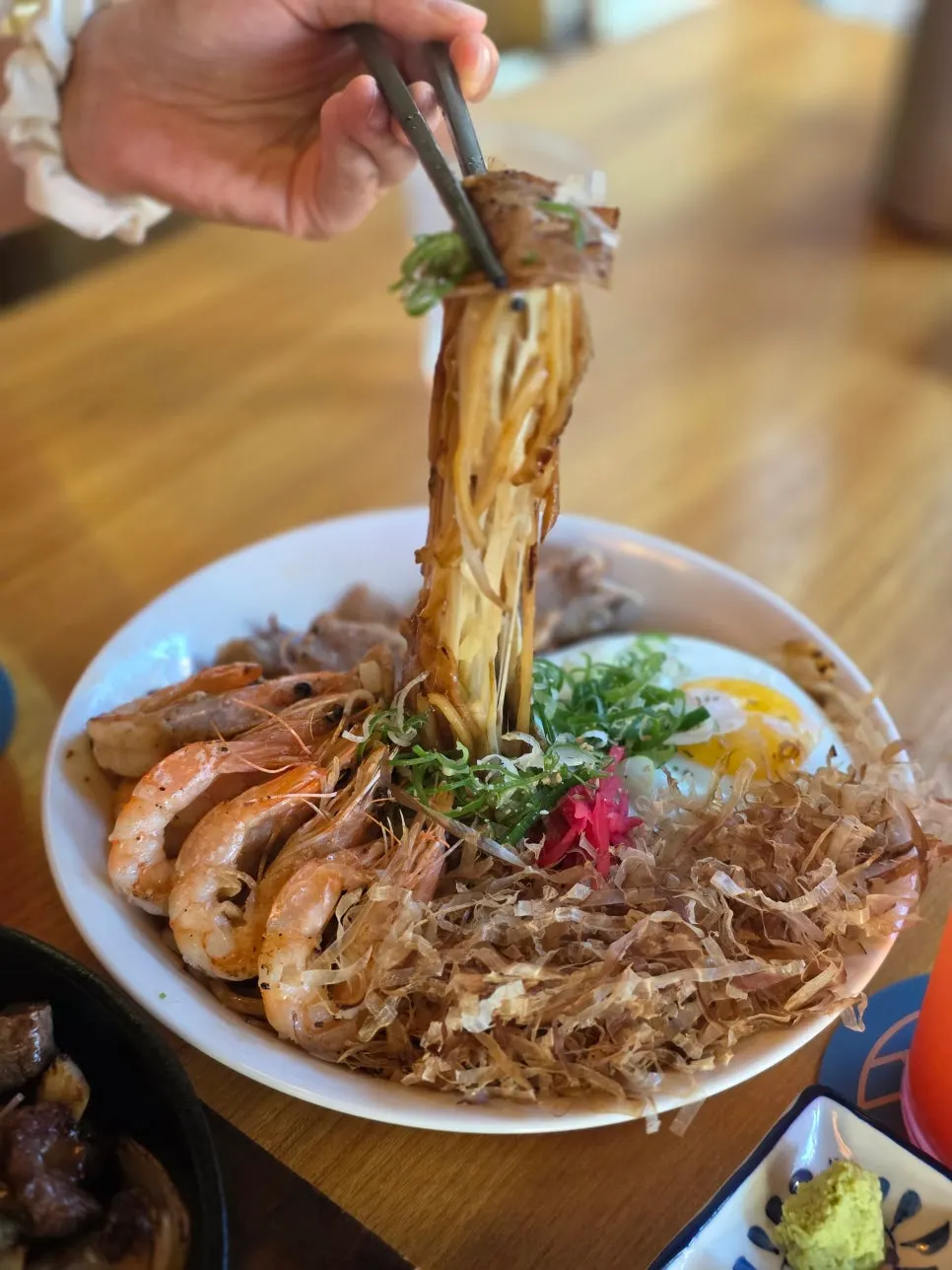 A bite of yakisoba with a plump shrimp