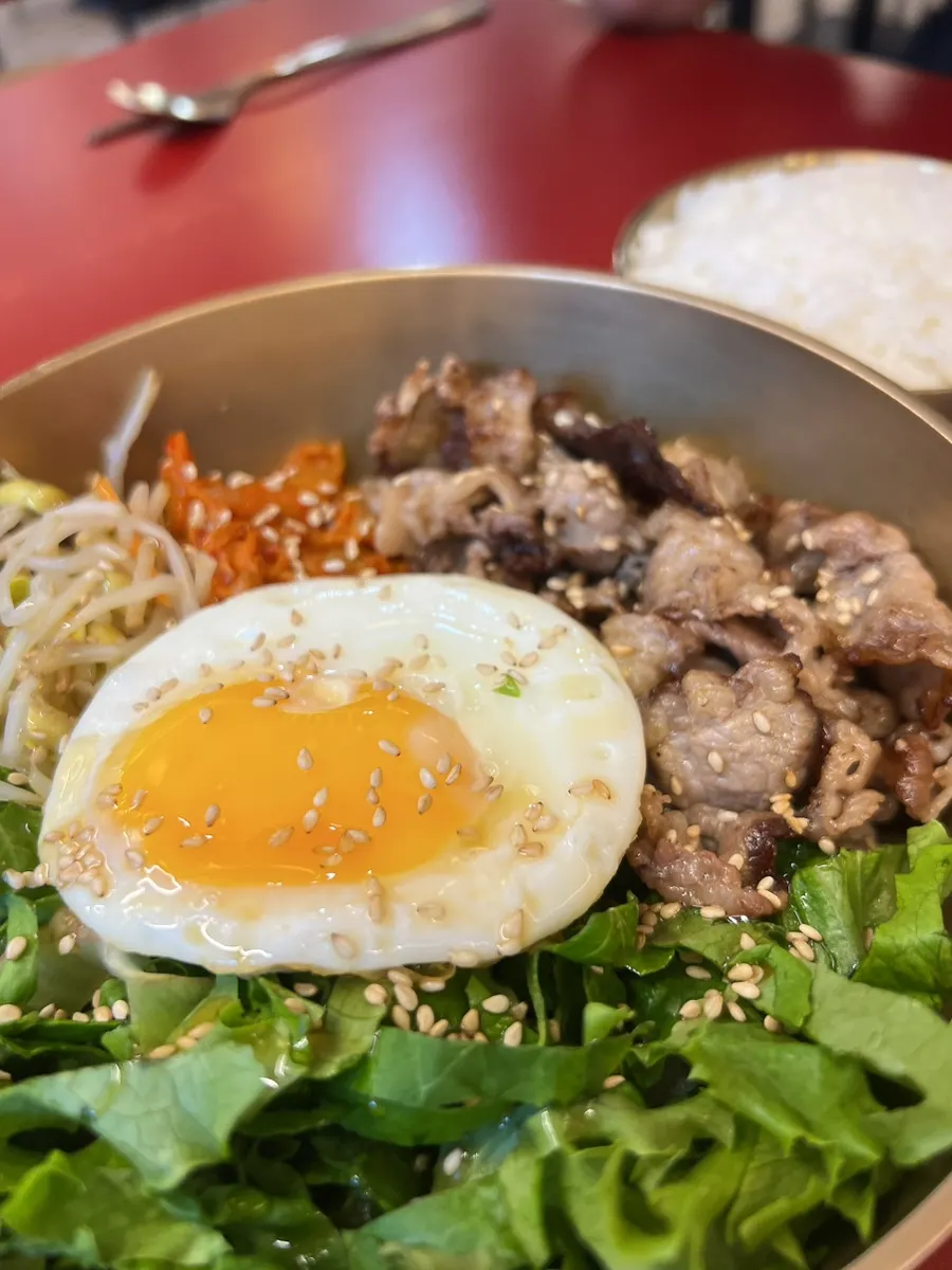 A glossy spoonful of beef short rib bibimbap