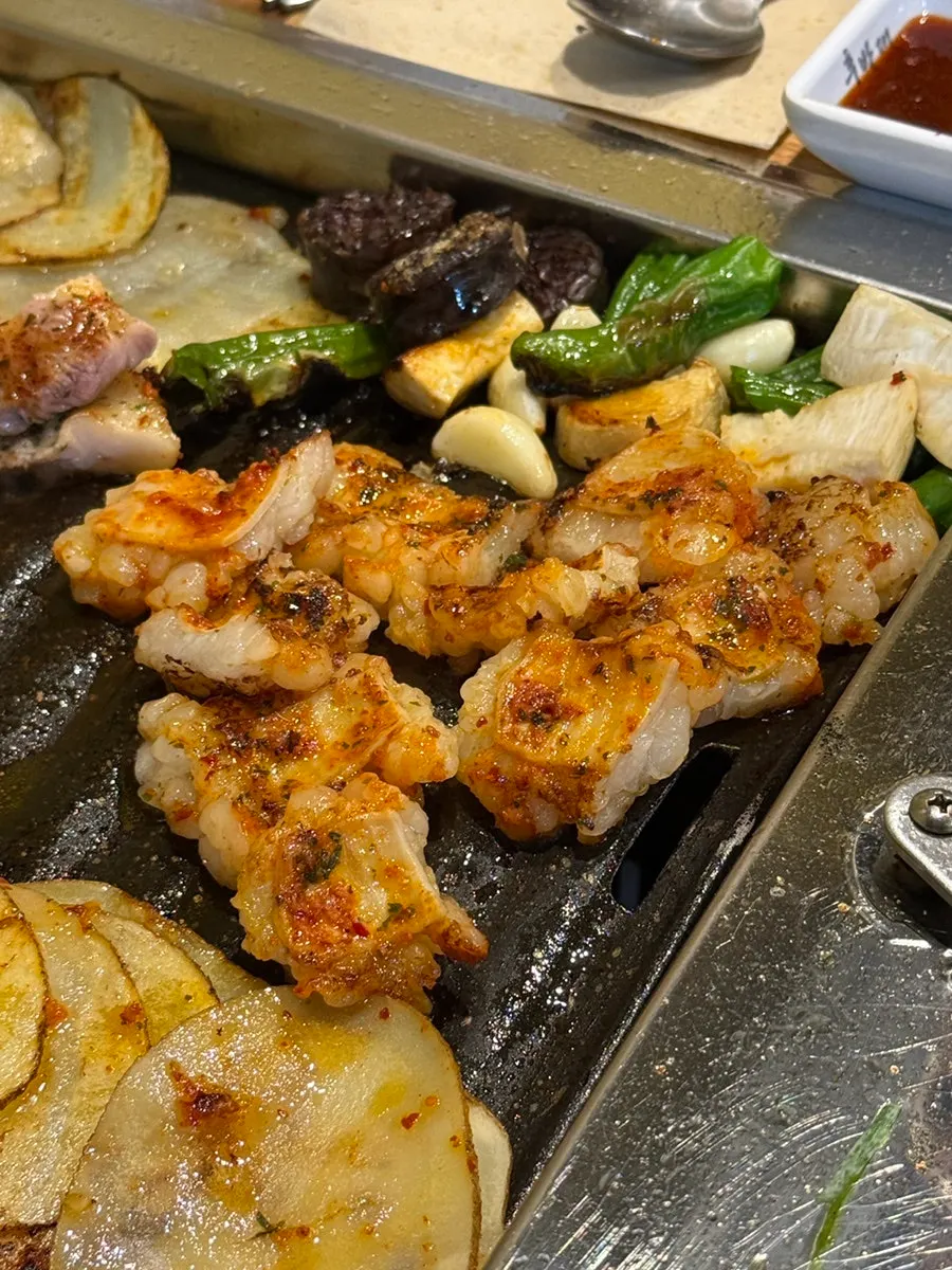Potatoes and meat on the grill