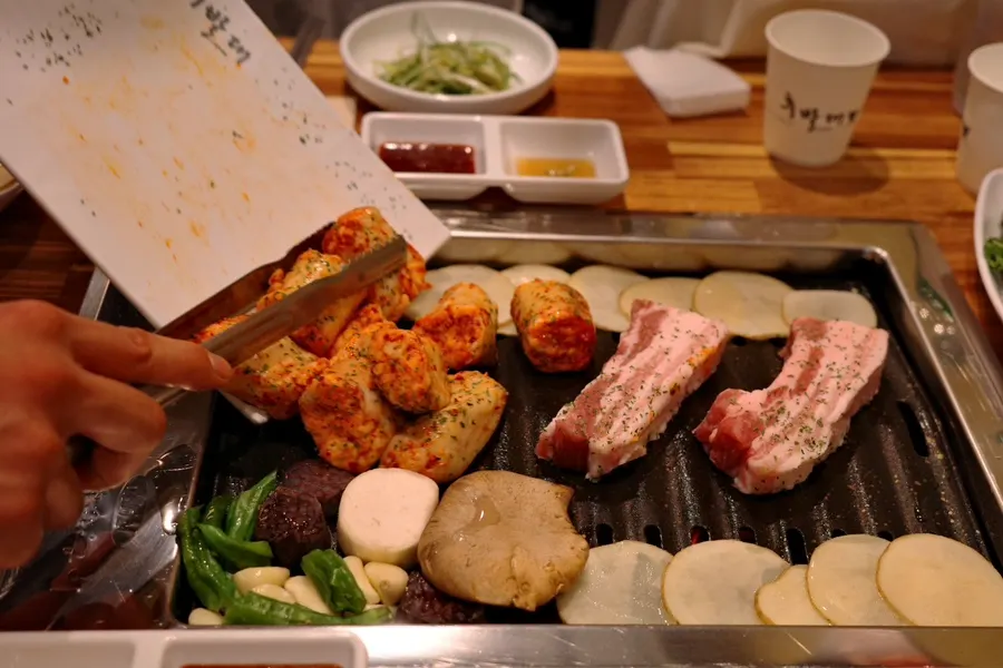 Raw fresh pork belly and Korean beef daechang that were ordered