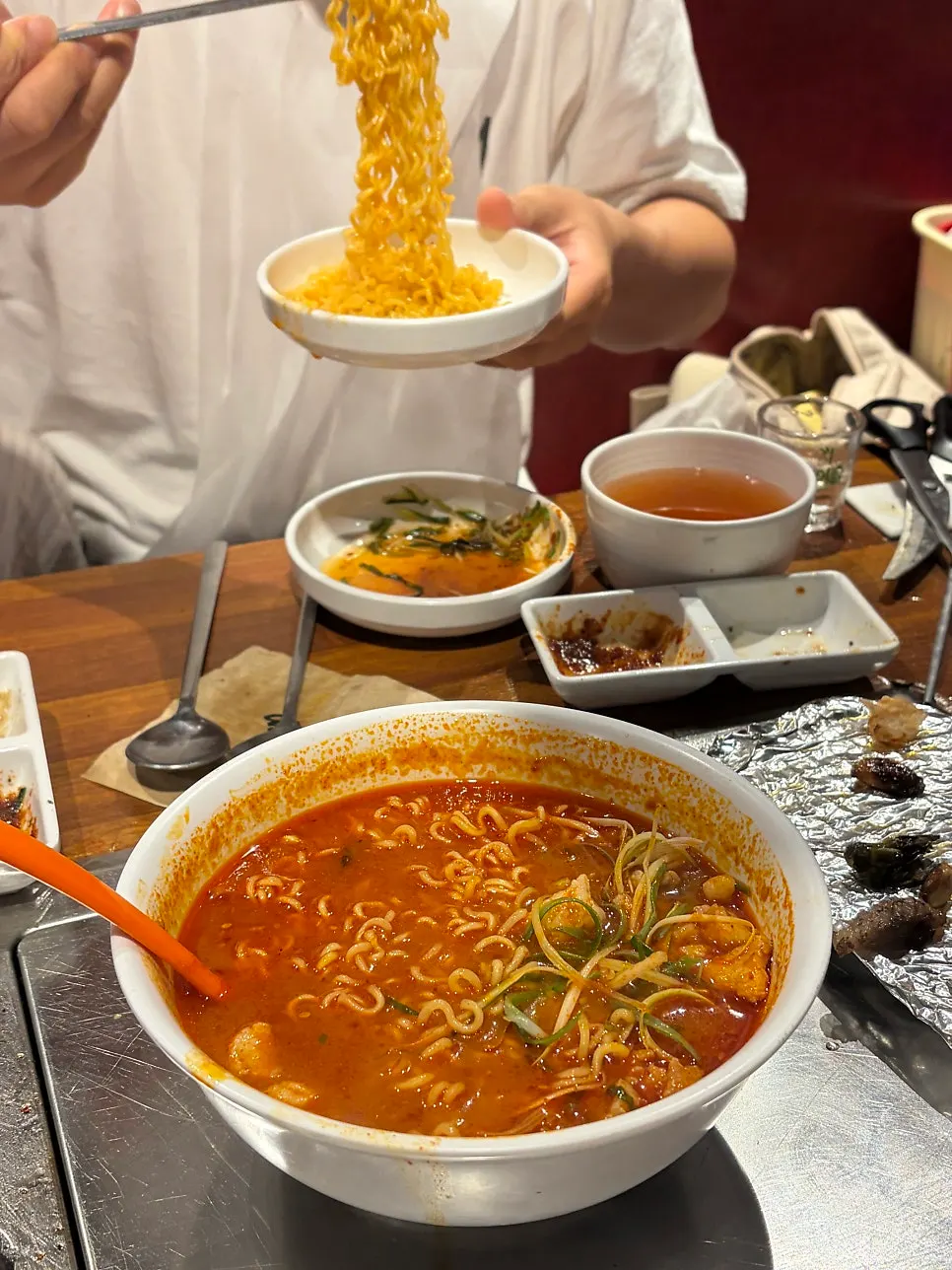 Finishing ramen with meat